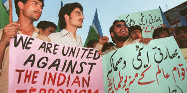 Activists of Pakistan's largest fundamentalist party Jamaat-i-Islami (JI) chant anti-India slogans during a demonstration organised against India's nuclear programme, here 13 May. They demanded Pakistan conduct its own nuclear test in response of today's new nuclear tests by India which already conducted three nuclear tests on 11 May. AFP PHOTO