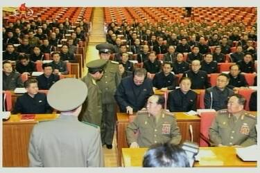 A still image taken from North Korea's state-run KRT television footage and released by Yonhap December 9, 2013, shows Jang Song Thaek being forcibly removed by uniformed personnel from a meeting of the Political Bureau of the Central Committee of the Workers' Party of Korea (WPK) in Pyongyang. North Korea on Monday excoriated Jang Song Thaek, the uncle of leader Kim Jong Un, for what it described as a slew of criminal acts, confirming the spectacular downfall of the once second most powerful man in the reclusive state. The sacking of Jang for mismanaging the economy, corruption, womanising and drug-taking comes after South Korean media reports that one of his aides has sought asylum in South Korea.   REUTERS/Yonhap  (NORTH KOREA - Tags: POLITICS MILITARY) ATTENTION EDITORS - THIS PICTURE WAS PROVIDED BY A THIRD PARTY. REUTERS IS UNABLE TO INDEPENDENTLY VERIFY THE AUTHENTICITY, CONTENT, LOCATION OR DATE OF THIS IMAGE. FOR EDITORIAL USE ONLY. NOT FOR SALE FOR MARKETING OR ADVERTISING CAMPAIGNS. NO SALES. NO ARCHIVES. THIS PICTURE IS DISTRIBUTED EXACTLY AS RECEIVED BY REUTERS, AS A SERVICE TO CLIENTS. NO THIRD PARTY SALES. NOT FOR USE BY REUTERS THIRD PARTY DISTRIBUTORS. SOUTH KOREA OUT. NO COMMERCIAL OR EDITORIAL SALES IN SOUTH KOREA