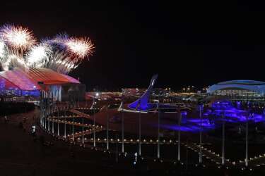 Fireworks are seen over Olympic Park during the opening ceremony of the 2014 Winter Olympics in Sochi, Russia, Friday, Feb. 7, 2014. (AP Photo/Julio Cortez)