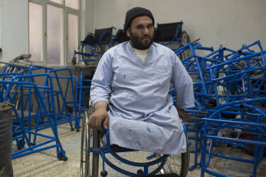 March 30, 2014 - Kandahar, Afghanistan - Mirwais Hospital sponsored by the Red Cross.An amputee employee organizes wheelchair components manufactured on site.
