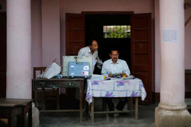 Indian election officials work to setup a polling station inside a school on the eve of the first phase of national elections in Dibrugarh, in the northeastern state of Assam, India, Sunday, April 6, 2014. India will hold national elections from April 7 to May 12, kicking off a vote that many observers see as the most important election in more than 30 years in the world's largest democracy. (AP Photo/Altaf Qadri)