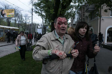 A pro-Ukrainian protester attacked by pro-Russian activists while an attempt to hold a peaceful pro-Ukrainian march in downtown of Donetsk, Eastern Ukraine.