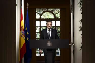 Spain's Prime Minister Mariano Rajoy enters the room to deliver a statement in the Moncloa Palace, Madrid, Spain, Monday, June 2, 2014. Spanish Prime Minister Mariano Rajoy announced in a press conference that King Juan Carlos plans to abdicate and pave the way for his son, Crown Prince Felipe, to become the country's next king. The 76-year-old Juan Carlos oversaw his country's transition from dictatorship to democracy but has had repeated health problems in recent years. His popularity also dipped following royal scandals, including an elephant-shooting trip he took in the middle of Spain's financial crisis that tarnished the monarch's image. The king came to power in 1975, two days after the death of longtime dictator Francisco Franco. (AP Photo/Daniel Ochoa de Olza)