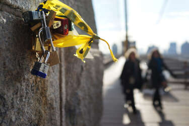 NEW YORK, NY - FEBRUARY 13: "Love locks" are viewed on the Brooklyn Bridge, one of thousands that have been placed along the bridge recently on February 13, 2013 in New York City. The phenomenon has gained followers in recent years as couples seek to publicly mark weddings, engagements, and anniversaries in a permanent way. Besides New York, "love locks" can be found on public monuments and bridges in Venice, St. Petersburg and Paris amongst other cities.   Spencer Platt/Getty Images/AFP