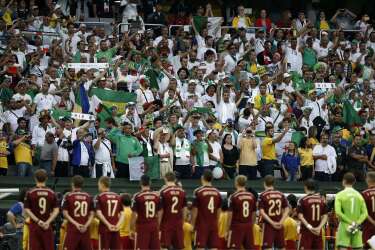 TOPSHOTS
Fans of Algeria stand during their national anthem before a Group H football match between Algeria and Russia at the Baixada Arena in Curitiba during the 2014 FIFA World Cup on June 26, 2014.  AFP PHOTO / ADRIAN DENNIS