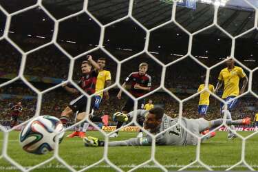Germany's Toni Kroos (18) scores a goal during their 2014 World Cup semi-finals against Brazil at the Mineirao stadium in Belo Horizonte July 8, 2014. REUTERS/Eddie Keogh (BRAZIL  - Tags: SOCCER SPORT WORLD CUP)