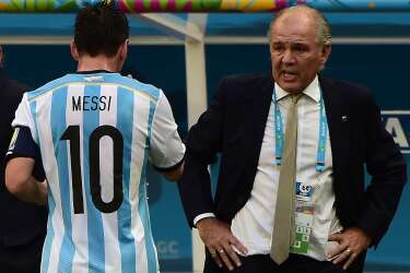Argentina's forward Lionel Messi (L) walks towards Argentina's coach Alejandro Sabella during a quarter-final football match between Argentina and Belgium at the Mane Garrincha National Stadium in Brasilia during the 2014 FIFA World Cup on July 5, 2014.  AFP PHOTO / FRANCOIS XAVIER MARIT