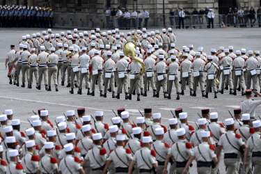 Soldiers of the French Foreign Legion parade on July 14, 2014 on the Champs Elysees avenue in Paris during the annual Bastille Day military parade. AFP PHOTO / STEPHANE DE SAKUTIN