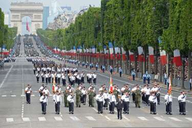 Students from the Air Forec special school march down the Champs-Elysees avenue during the annual Bastille Day military parade in Paris, on July 14, 2014.   AFP PHOTO / ALAIN JOCARD