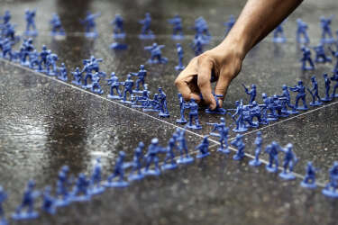 A Bangladeshi student makes a formation, using toy soldiers, representing the star of David during a demonstration by students of Dhaka University against Israeli attack on Gaza in Dhaka, Bangladesh, Wednesday, July 16, 2014. (AP Photo/A.M. Ahad)
