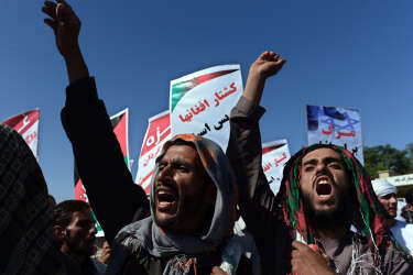 Afghan demonstrators shout slogans against Israeli attacks on Palestinian territories during a demonstration in front of the Eid Gah Mosque in the city of Kabul on July 18, 2014. Israel warned July 18 it could broaden a Gaza ground assault aimed at smashing Hamas's network of cross-border tunnels, as it stepped up attacks that have killed more than 260 Palestinians. AFP PHOTO/Wakil Kohsar