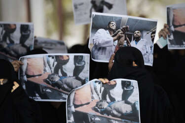 Bahraini women hold pictures of victims during a protest against Israel's military operation in the Gaza Strip on July 18, 2014, in the village of Diraz, west of Manama. Israel launched a major offensive in Gaza on July 8 aimed at halting cross-border rocket fire by Palestinian militants and began a ground operation preceded by an intense bombardment on July 18.   AFP PHOTO/MOHAMMED AL-SHAIKH