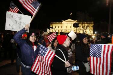 Supporters of U.S. President Barack Obama march in front of the White House in Washington, after he spoke live on television about relaxing U.S. immigration policy, November 20, 2014. Obama imposed the most sweeping immigration reform in a generation on Thursday, easing the threat of deportation for about 4.7 million undocumented immigrants and setting up a clash with Republicans.    REUTERS/Larry Downing   (UNITED STATES - Tags: POLITICS SOCIETY IMMIGRATION)