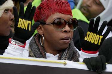 WASHINGTON, DC - DECEMBER 13: Lesley McSpadden, mother of police shooting victim Michael Brown helps lead the "Justice For All" rally and march in the nation's capital against police brutality and the killing of unarmed black men by police, December 13, 2014 in Washington, DC. Organized by Rev. Al Sharpton's National Action Network, this march and other like it across the country aim to tell Congress and the country that demonstrators will not stand down until there is systemic change, accountability and justice in cases of police misconduct. Sharpton said the demonstration is happening in Washington "because all over the country we all need to come together and demand this Congress deal with the issues, that we need laws to protect the citizens in these states from these state grand jurors."   Chip Somodevilla/Getty Images/AFP
== FOR NEWSPAPERS, INTERNET, TELCOS & TELEVISION USE ONLY ==