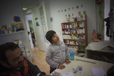 Athens, Greece 2015A young boy looking for assistance at the pediatrics unit of the polyclinic of the "Doctors of the world".Inside the polyclinic of the human rights organisation Medecins du Monde (Doctors of the World), that provides free primary health care to people who cannot afford those services in Greece, and its patient roster has been growing steadily since the financial crisis struck.