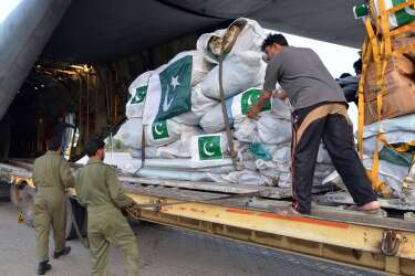 In this handout photograph released by Pakistan's Inter Services Public Relations (ISPR) office on April 26, 2015, Pakistani soldiers load relief supplies for victims of the Nepal earthquake into a C-130 aircraft at the Chaklala military airbase in Rawalpindi. Rescuers in Nepal are searching frantically for survivors of a huge quake on April 25, 2015, that killed nearly 2,000, digging through rubble in the devastated capital Kathmandu and airlifting victims of an avalanche at Everest Base Camp. AFP PHOTO / INTER SERVICES PUBLIC RELATIONS -----EDITORS NOTE---- RESTRICTED TO EDITORIAL USE MANDATORY CREDIT "AFP PHOTO / INTER SERVICES PUBLIC RELATIONS/ HO " ---- NO MARKETING NO ADVERTISING CAMPAIGNS - DISTRIBUTED AS A SERVICE TO CLIENTS